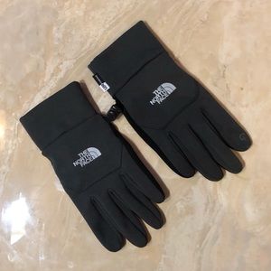Grey and black North Face gloves